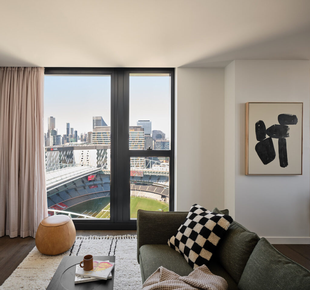 Apartment lounge with a Marvel Stadium view | BTR News Australia